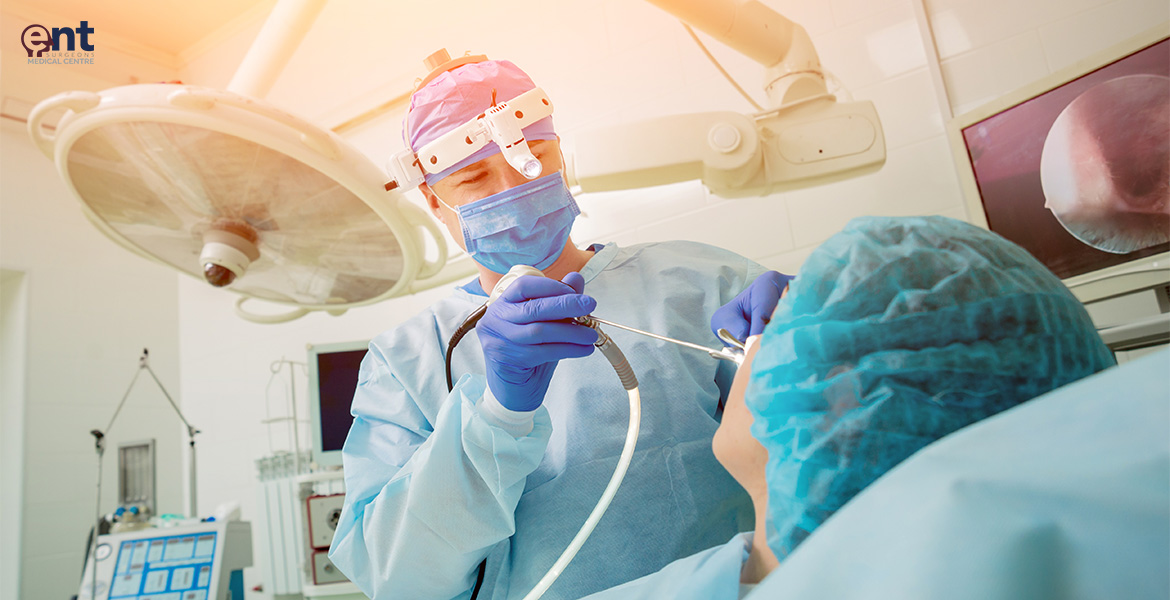 Surgeon performing minimally invasive endoscopic sinus surgery.